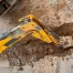 Excavating home foundation for sewer line replacement.