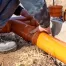 Plumber working on a home sewer line.