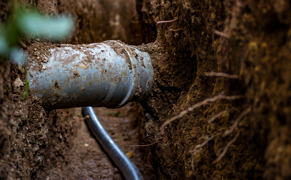 A sewer pipe in the ground.