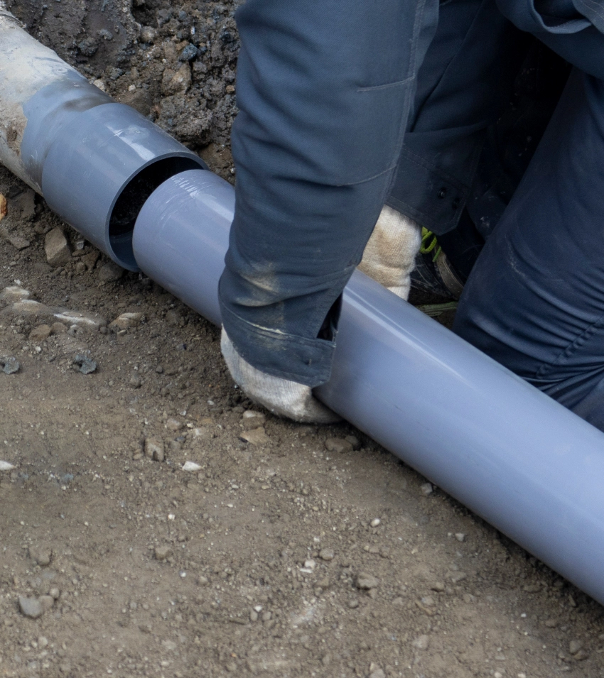 A professional working on a sewer line repair.