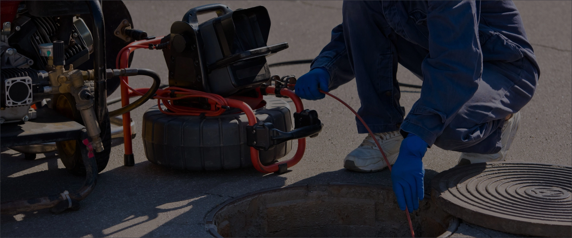 A person working on a sewer system.